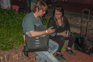 An Arcanum Master talking with a fellow photo walker